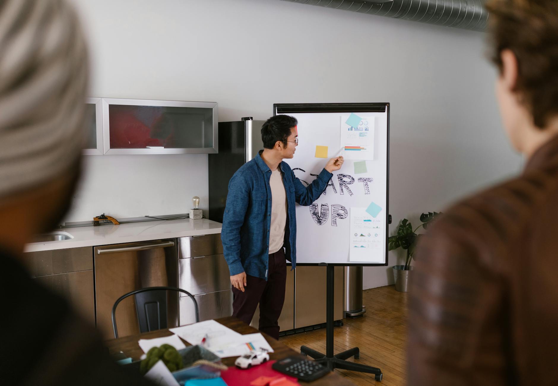 Team members discussing project ideas in a modern office setting.